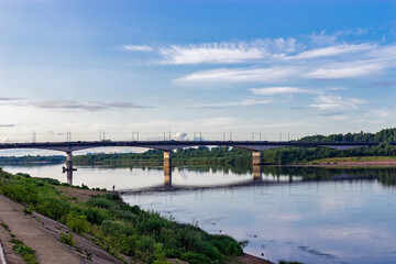 Fototapeta na wymiar bridge over the river on a calm summer evening