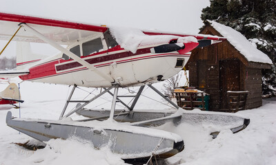 Obraz na płótnie Canvas Float Plane Covered With Snow,Lake Spenard,Anchorage,Alaska,USA