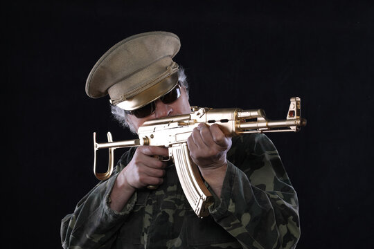 military officer with a golden AK-47