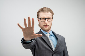 portrait man businessman showing gesture STOP