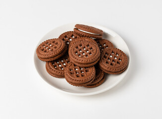 Macro photo of chocolate cookies with filling on a white background. Isolate, close up