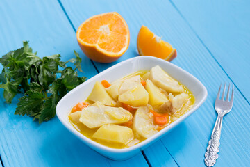 celery salad with lemon on blue background.