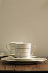 White cups for tea on a wooden table