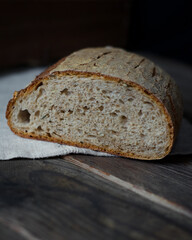 loaf of sourdough bread on wooden table