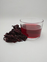 Dried hibiscus flowers and Hibiscus flower tea white background (Hibiscus sabdariffa)
