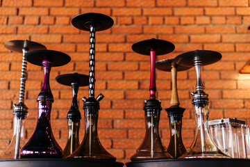 Hookahs in an assortment of different shapes and colors, side view, beautiful transparent glass,...