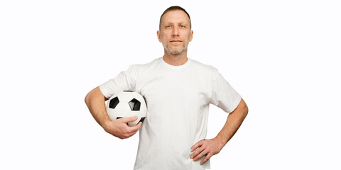 One man holds a soccer ball in akimbo posing. Soccer player isolated on white background