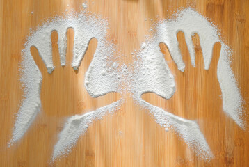kitchen work table for kneading the dough with flour, and handprints