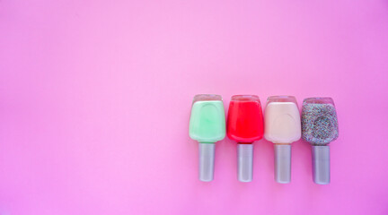 tubes of nail Polish. Red green brown nail Polish photo