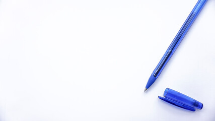 blue ballpoint pens on a white background photo