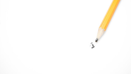 broken pencils are lying on a white background photo
