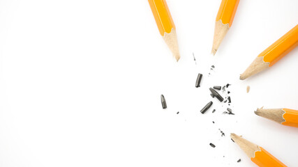broken pencils are lying on a white background photo