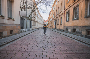 Young woman walking on European street