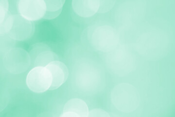 Defocused abstract background green lights. The theme of ecology, healthy lifestyle. Medicine, science, technology. Rod designer abstraction for writing of the text.