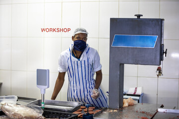 butcher preparing burgers patty