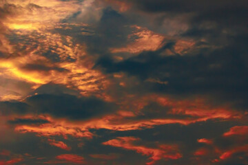 Incredibly picturesque sky in dark blue, red, yellow tones. Divinely beautiful. Heavy cloud. Summer season. Dream.