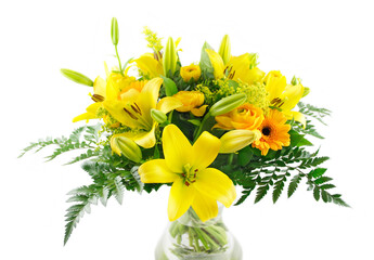 Yellow mixed flowers bouquet in vase isolated in white background.