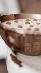 Milk and flowers in cup.