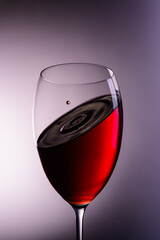 
a drop of wine flies into a wine glass4