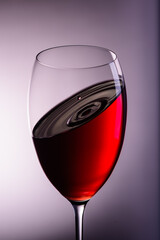 
a drop of wine flies into a wine glass3