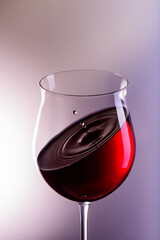 
a drop of wine flies into a wine glass2