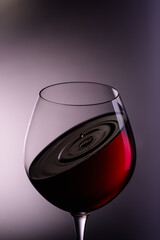 
a drop of wine flies into a wine glass1