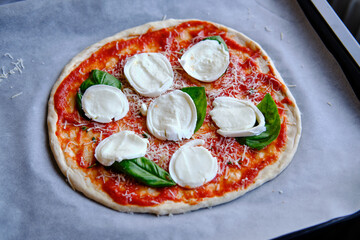 Making margherita pizza at home