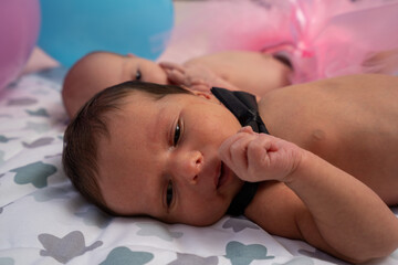 Newborn twin babies, boy and girl