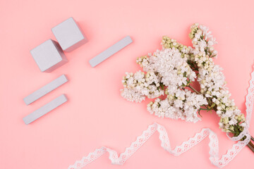 Greeting card in gentle tones. A bouquet of lilacs in lace and calendar.