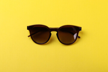 a pair of female or male sunglasses as the means of sun protection or fashionable accessories on...