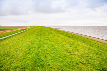 Fototapeta na wymiar Permanent slope protection along the sea shore near Harlingen, Netherlands