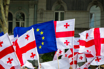 Georgian flag and European union flag.Georgian protests in front of the Parliament of Georgia, also...
