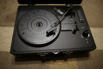 Retro vinyl record player. Vintage Gramophone. Black vinyl player.

