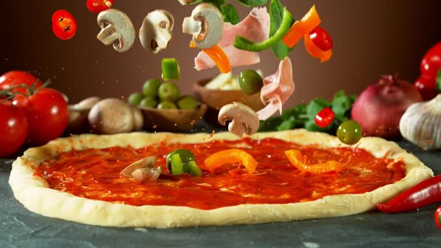 Super slow motion of falling pizza ingredients on yeast dough. Filmed on high speed cinema camera, 1000 fps.