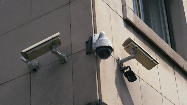 Surveillance cameras on the building covering three different corners.
