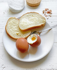 boiled eggs and bread with butter