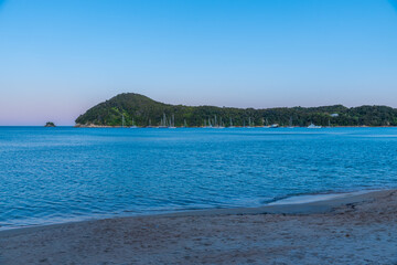 Sunset view of boats mooring at Torrent bay at Abel Tasman national park in New Zealand