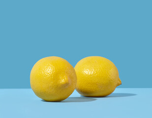 fresh lemons on blue background
