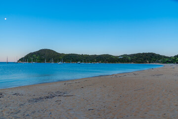 Sunset view of boats mooring at Torrent bay at Abel Tasman national park in New Zealand