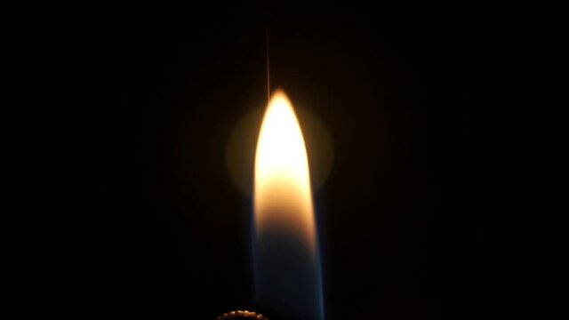 Lighter Flame at night on a table
