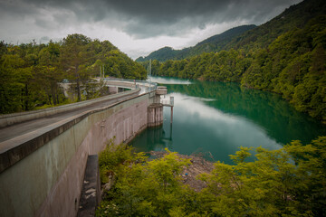 Small but steep dam for hydroelectric plant in Moste, Slovenia. View of the hidroelectric dam from above, looking down.