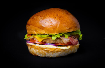 fresh tasty burger on a black background
