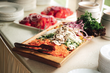 Sliced various fresh vegetable on buffet table for vegetable garnish to main dish. Celebration, party, birthday or wedding concept.