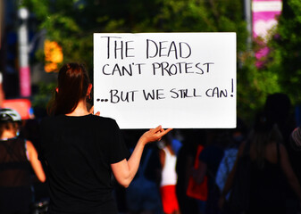 The dead can't protest... but we still can. A sign in Black lives matter march