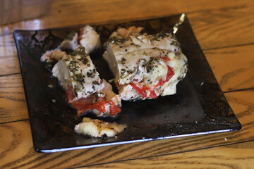 Baked chicken breast stuffed with tomatoes and spices