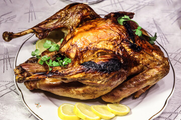 baked turkey with herbs and lemon slices.