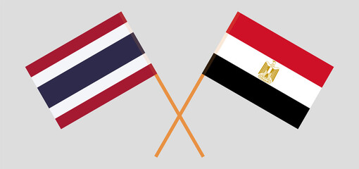 Crossed flags of Egypt and Thailand