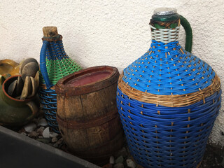 Old wine jugs and barrel in the cellar