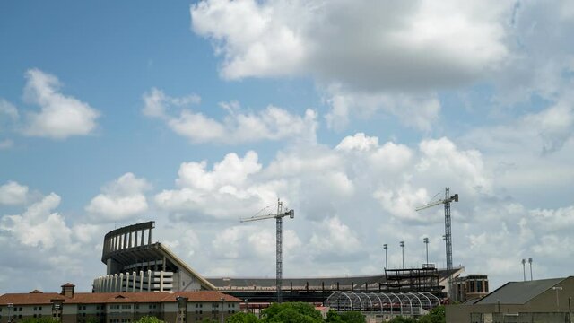 Mid day Time Lapse of Clouds Over empty College Stadium
