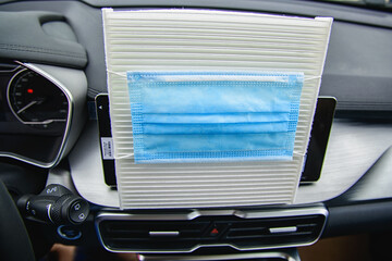 car air conditioner air filter and a protective mask against bacteria on it